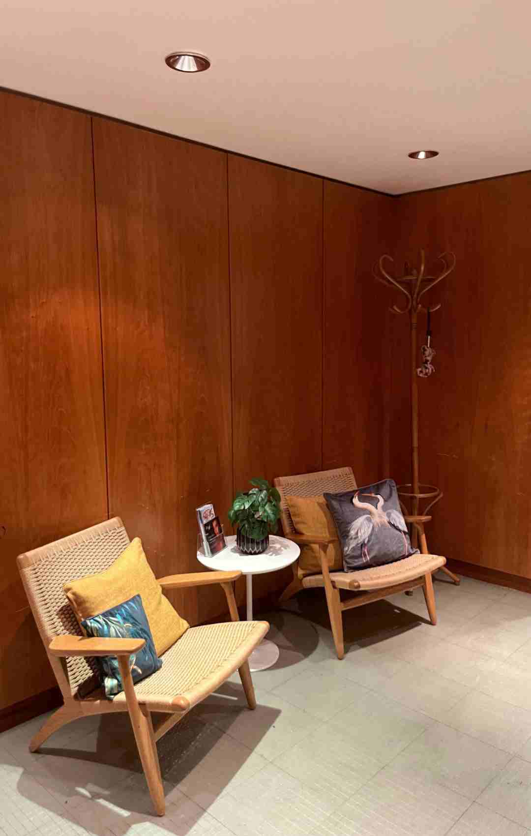 Two minimalist rattan Reception Chairs in a waiting room for Luminis Beauty Spa in Canary Wharf. 