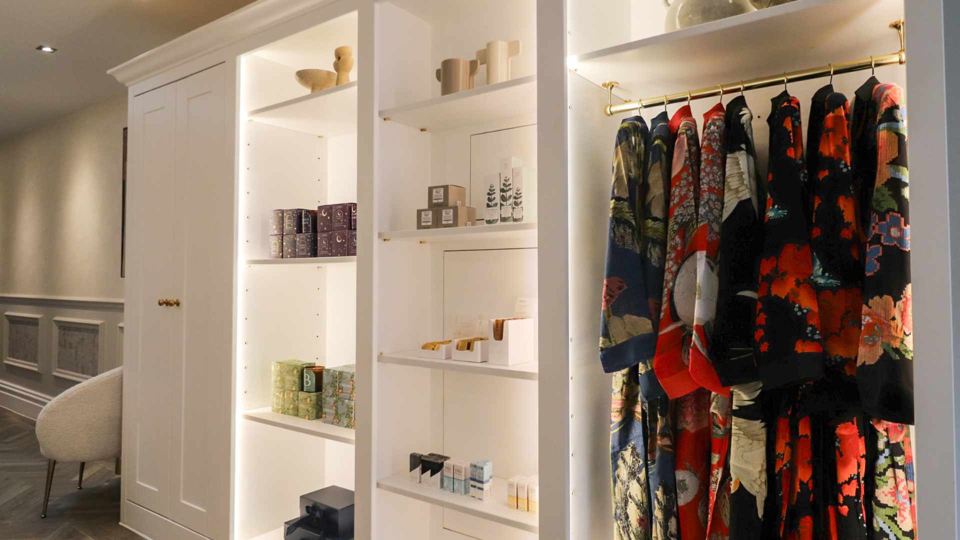 The retail shop display including bath robes, beauty products and luxury skincare brands.