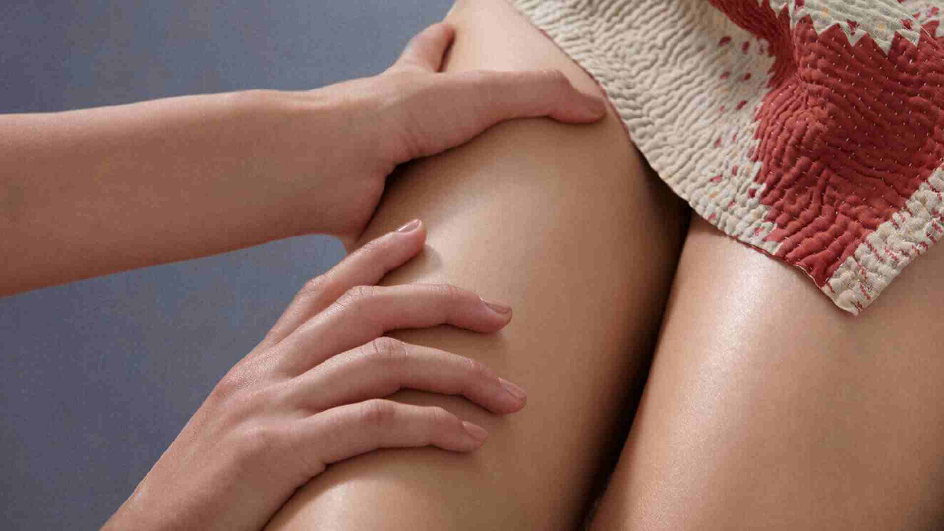 A close up of a woman's smooth legs after receiving a fresh waxing hair removal treatment.