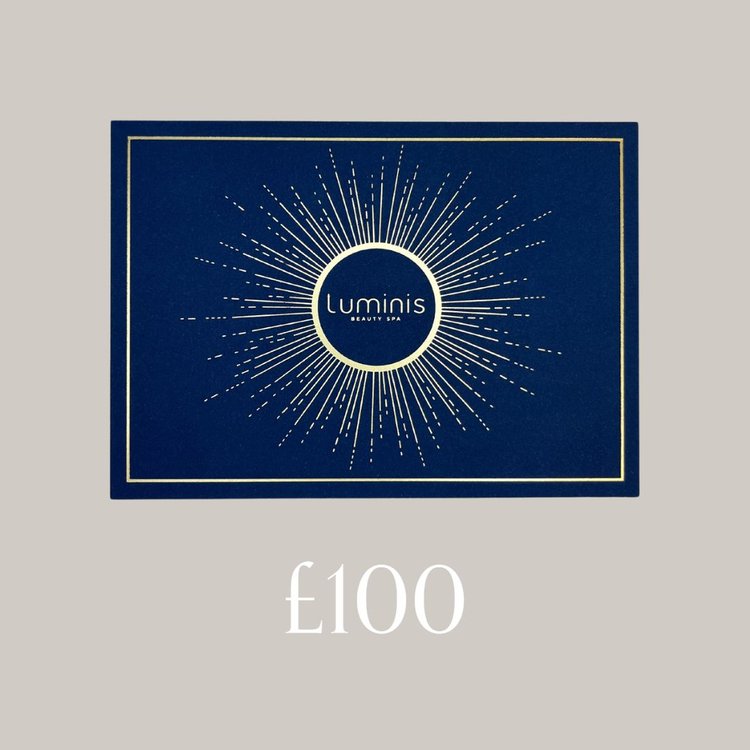 A flat lay photo of a Luminis Gift card featuring a grey background and £100 title below.