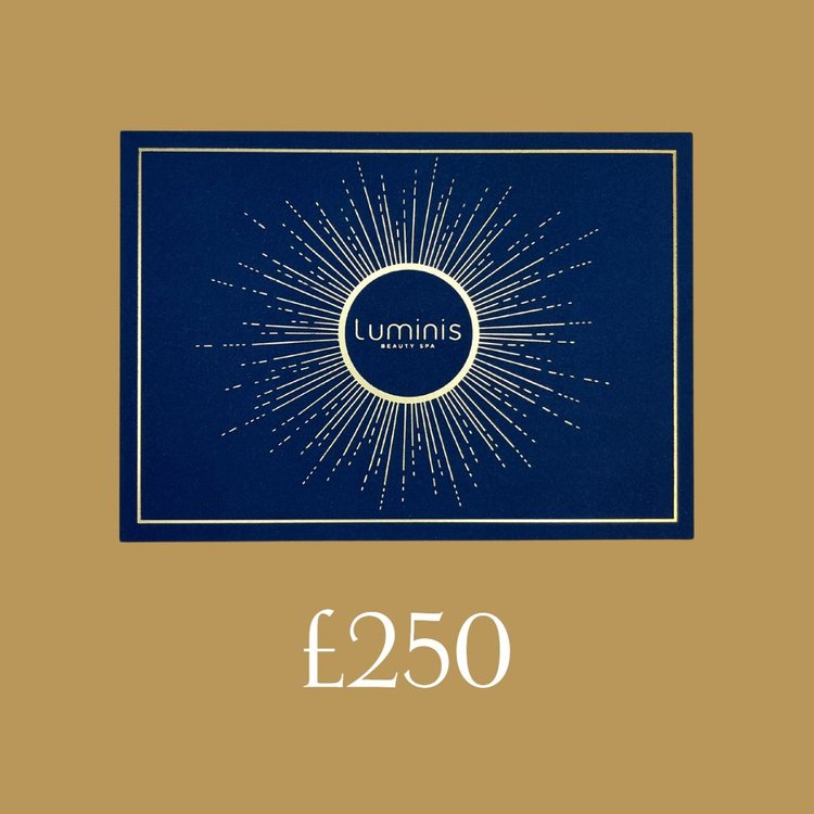A flat lay photo of a Luminis Gift card featuring a gold background and £250 title below.