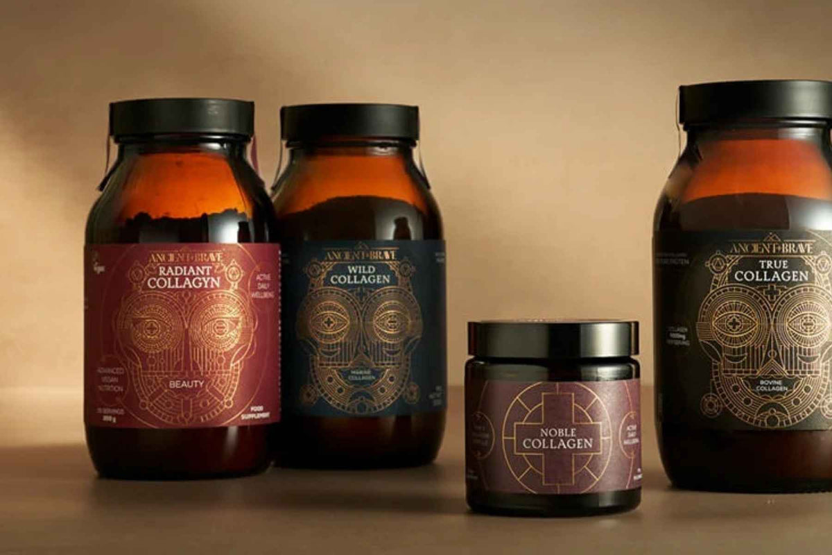 Collection of collagen supplement bottles with decorative labels on a beige background