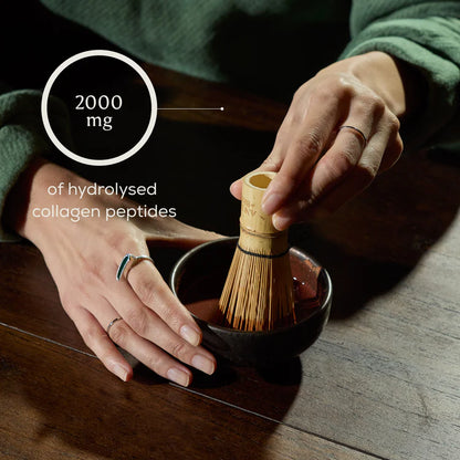 Person using a wooden whisk to prepare a bowl of tea with text about hydrolysed collagen peptides.