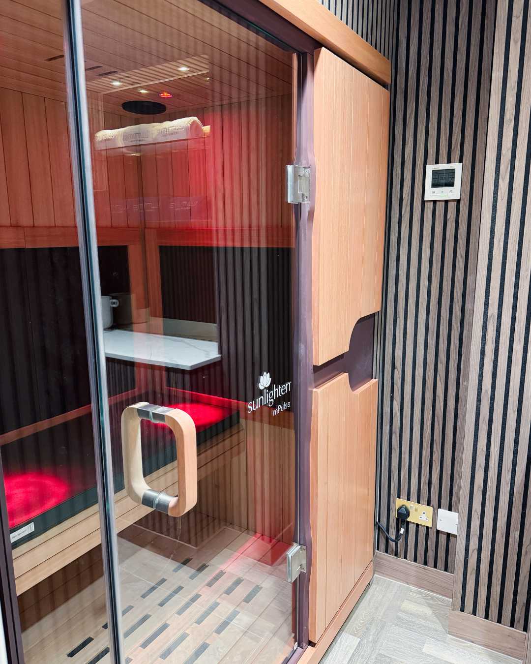 Infrared sauna located at Luminis Chislehurst, a modern wellness and beauty salon. 