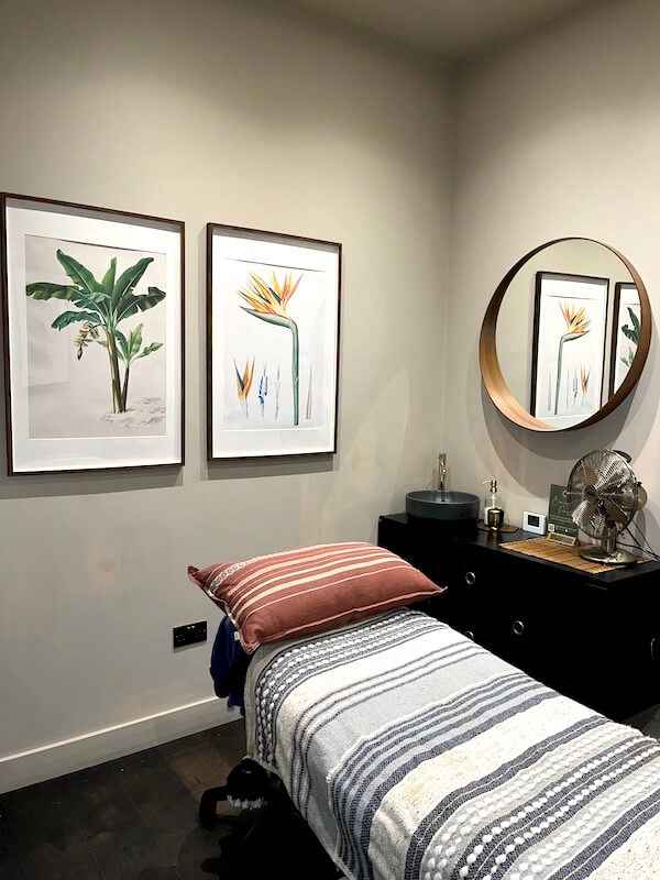  A modern beauty treatment room in a Beauty Spa with a massage bed.