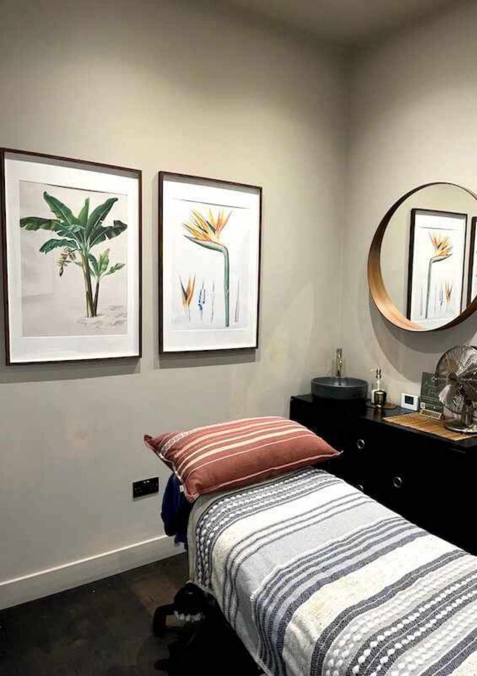  A modern beauty treatment room in a Beauty Spa with a massage bed.