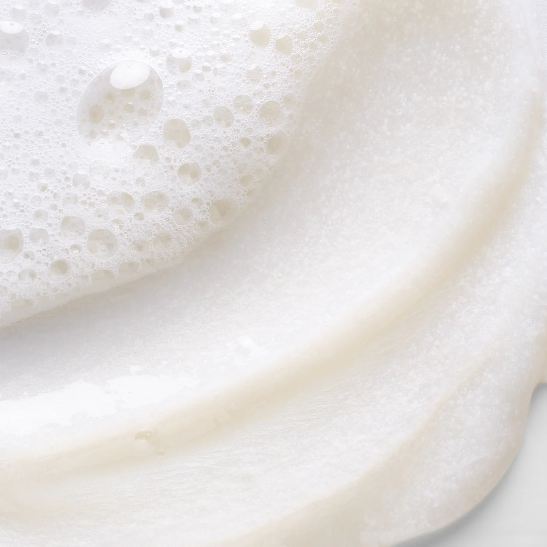 Close-up of a white creamy texture with bubbles