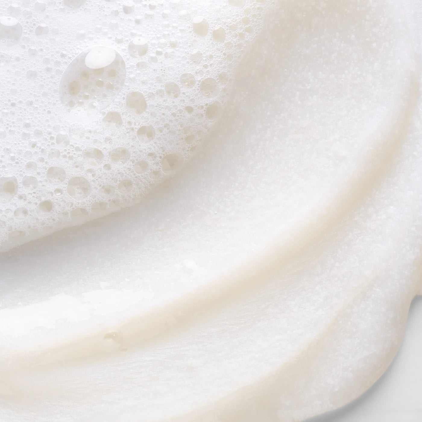 Close-up of a white creamy texture with bubbles