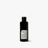 Black bottle of skincare product on a white background