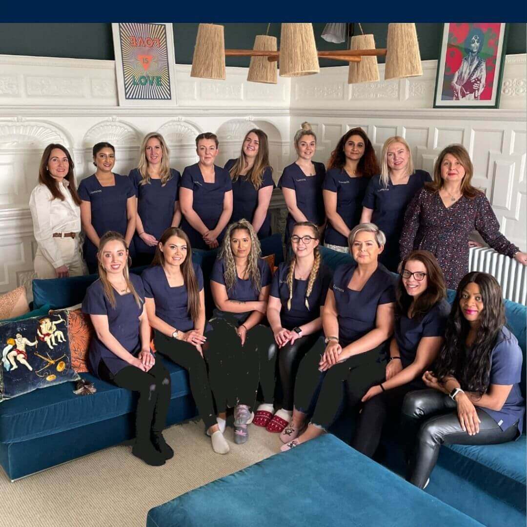 A group photo of all the therapists and team members working at Luminis Beauty Salon.