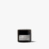 Black jar of skincare cream on a white background