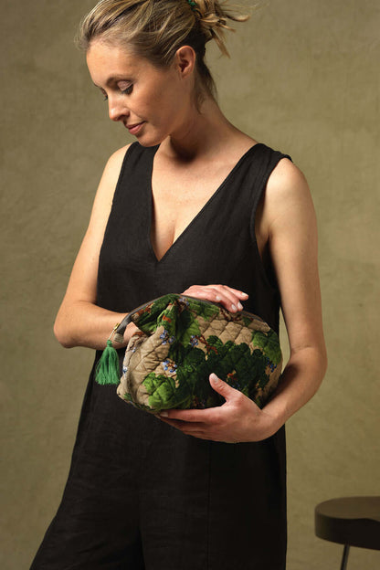 A woman modelling the Acer Stone pouch from One Hundred Stars in her hands.